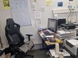 an office with a lot of clutter and clutter on the desk