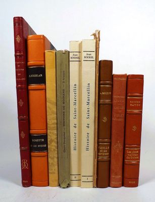 a lot of books that are lined up on a shelf
