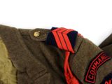 a close up of a jacket with a red tie on it