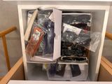 a drawer with a bunch of items in it
