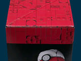 a red box with a toy inside of it on a table