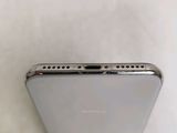 a close up view of the back of a silver iphone