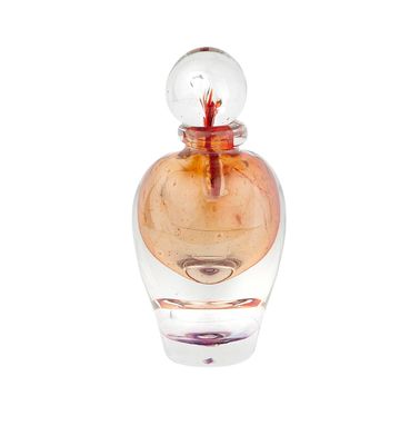 a small glass bottle with a red flower inside of it