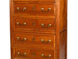 a tall wooden chest of drawers with a marble top