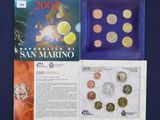 a close up of a book with a bunch of coins on it