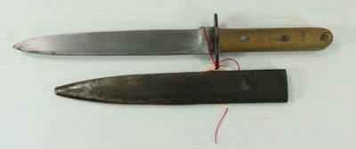 two knives that are on a white surface