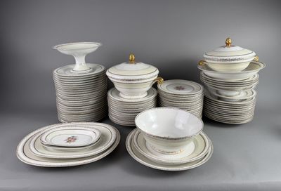 a lot of plates and bowls on the table