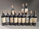 several bottles of wine are lined up in a row on a table
