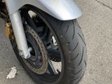 a motorcycle that is parked on the side of the street