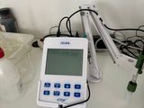 a white and blue electronic device sitting on a table