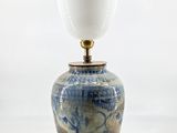 an image of a blue and white vase with a lamp on it