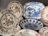 a lot of plates that are sitting on a table