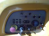 a close up of a control panel on a yellow vehicle