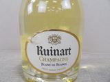 a bottle of rummart champagne on a table