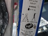 a close up of a parking meter with a sticker on it