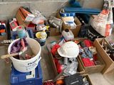 many boxes of assorted items sitting on the floor