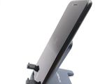 a cell phone that is sitting on top of a stand