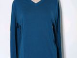 blue v - neck sweater on a mannequin mannequin mannequin mannequin mannequin mannequin mannequin mannequin mann