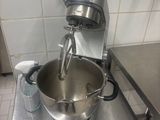 a mixer that is sitting on a table in a kitchen