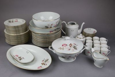 a lot of plates and cups and saucers on the table