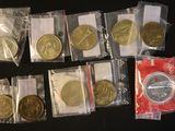 a lot of coins in the bags on the table