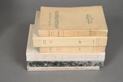 three books stacked on top of each other on a table