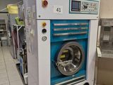 an image of a commercial washing machine in a commercial washroom