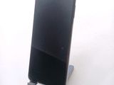 a cell phone that is sitting on a stand