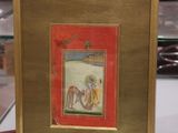 tableau représentant un homme et une femme à cheval, dans un cadre rouge