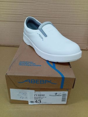 a white shoe that is on top of a box