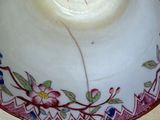 a white bowl with a floral design on it