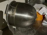 an image of a kitchen area with a mixer and other items on the floor