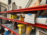 many boxes and boxes on the shelves in the garage