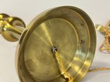 gold plated brass table lamp with a chain on a white background