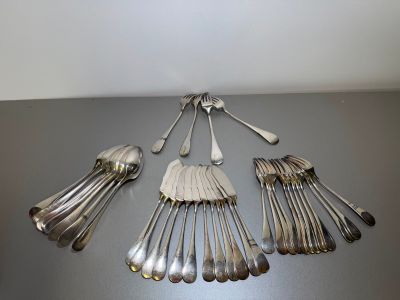 a lot of silver spoons and spoons on a table