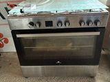 a stove that is sitting on the floor in front of a box