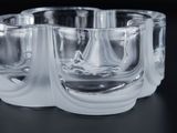 four glasses that are sitting on a table