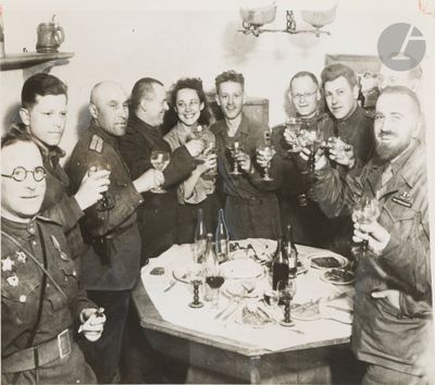 a group of people that are holding glasses of wine