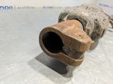 a rusted pipe on the floor in a room
