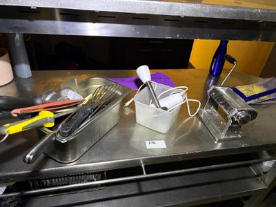 many utensils that are sitting on a metal counter