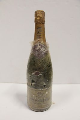 a bottle of wine that has been wrapped in plastic
