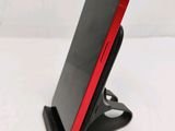 a close up of a cell phone on a stand
