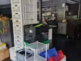 many crates stacked on top of each other in a warehouse