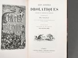 an open book with a picture of a man riding a horse on the cover