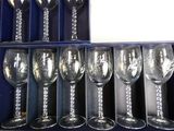 six wine glasses in a blue box on a shelf