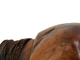 a wooden horse head with a rope around it ' s neck