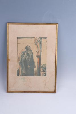 painting of a man with a long beard in a gold frame on a blue wall