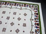 an image of a table cloth with a picture of people on it