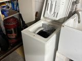 a washer and a dryer in a small room