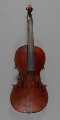 an old violin with a bow on a gray background